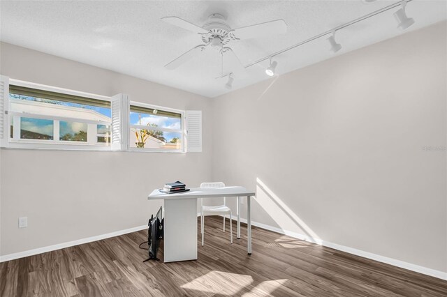 307 Orangewood Ln, Largo, FL 33770 - office area featuring baseboards, ceiling fan, track lighting, and wood finished floors