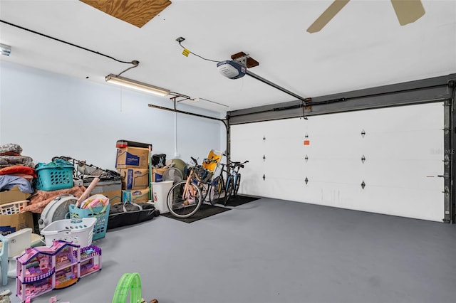 307 Orangewood Ln, Largo, FL 33770 - garage featuring a garage door opener and a ceiling fan