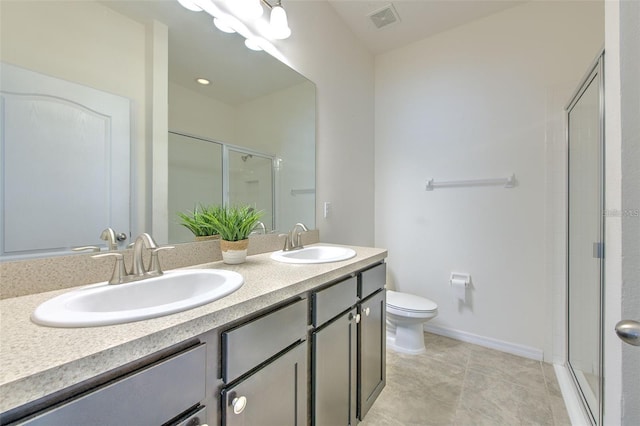 full bathroom featuring toilet, visible vents, a sink, and a stall shower