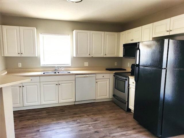 kitchen featuring light countertops, white cabinets, black appliances, a sink, and dark wood-style floors