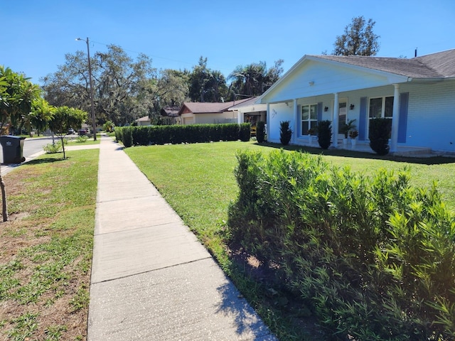 view of yard with covered porch