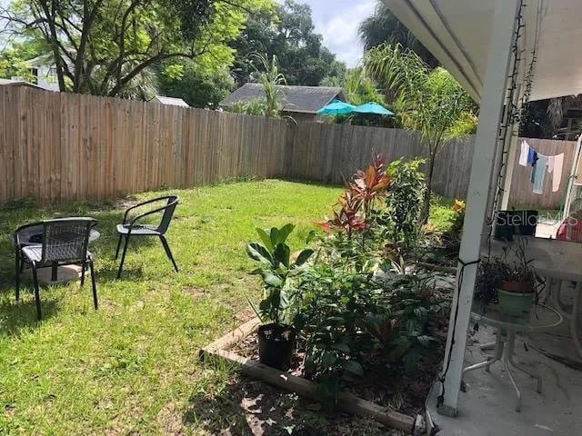 view of yard with a fenced backyard