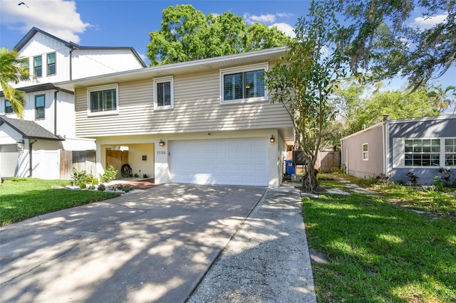 1735 Maryland Ave NE, Saint Petersburg, FL 33703 - view of front of home featuring an attached garage and concrete driveway