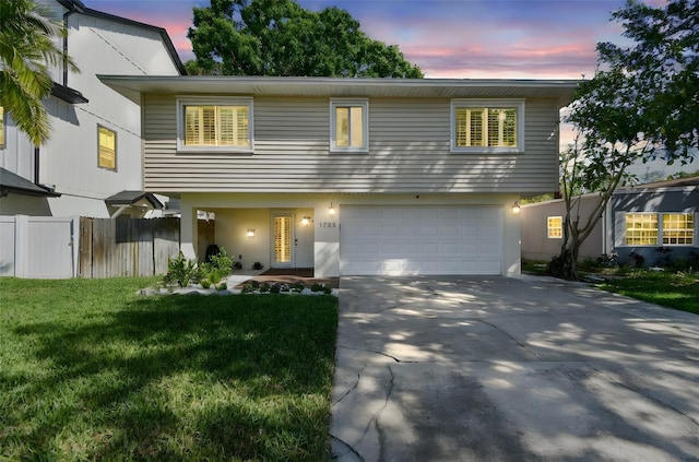 1735 Maryland Ave NE, Saint Petersburg, FL 33703 - view of front of home with driveway, an attached garage, and stucco siding