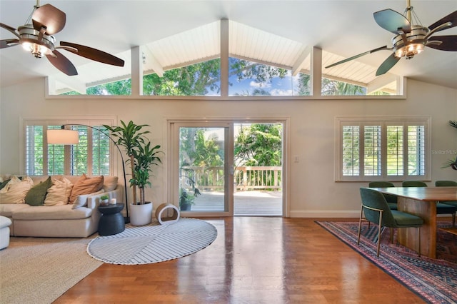 1735 Maryland Ave NE, Saint Petersburg, FL 33703 - living area featuring lofted ceiling, ceiling fan, wood finished floors, healthy amount of natural light, and baseboards