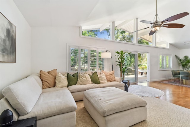 1735 Maryland Ave NE, Saint Petersburg, FL 33703 - living area with lofted ceiling, ceiling fan, wood finished floors, and baseboards
