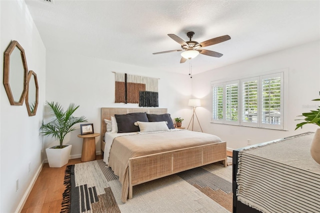 1735 Maryland Ave NE, Saint Petersburg, FL 33703 - bedroom with light wood-type flooring, baseboards, and ceiling fan