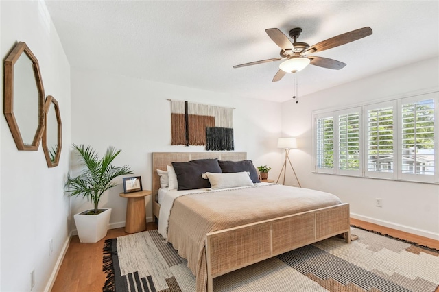 1735 Maryland Ave NE, Saint Petersburg, FL 33703 - bedroom with wood finished floors, baseboards, and a ceiling fan
