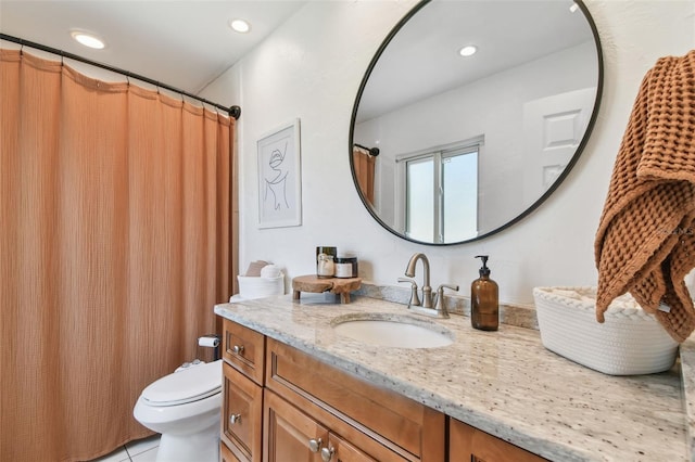 1735 Maryland Ave NE, Saint Petersburg, FL 33703 - bathroom featuring toilet, vanity, recessed lighting, and tile patterned flooring