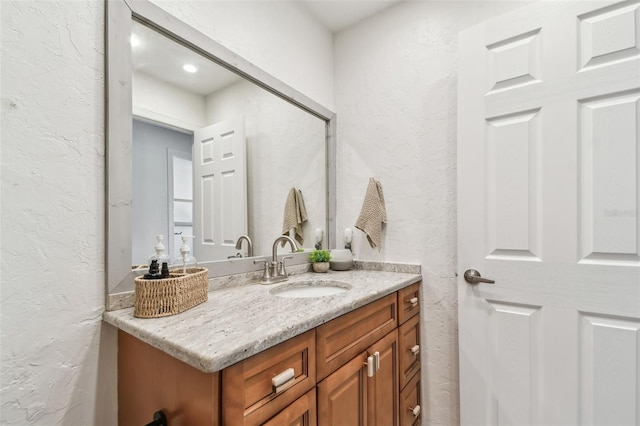1735 Maryland Ave NE, Saint Petersburg, FL 33703 - bathroom with a textured wall and vanity