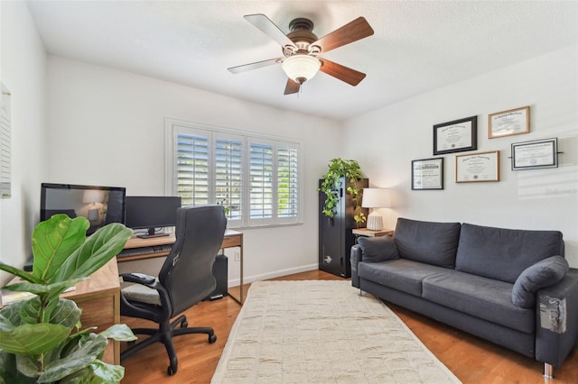 1735 Maryland Ave NE, Saint Petersburg, FL 33703 - office space featuring wood finished floors, a ceiling fan, and baseboards