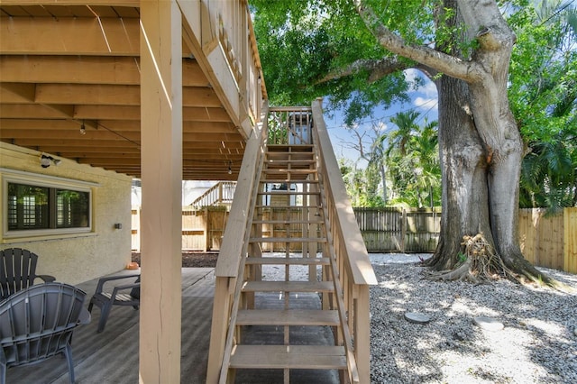1735 Maryland Ave NE, Saint Petersburg, FL 33703 - wooden deck featuring stairway and a fenced backyard
