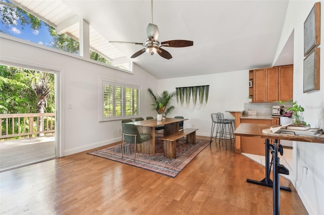 1735 Maryland Ave NE, Saint Petersburg, FL 33703 - dining space featuring ceiling fan, light wood-style flooring, baseboards, and high vaulted ceiling