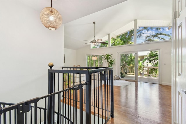1735 Maryland Ave NE, Saint Petersburg, FL 33703 - hall with an upstairs landing, wood finished floors, baseboards, and high vaulted ceiling