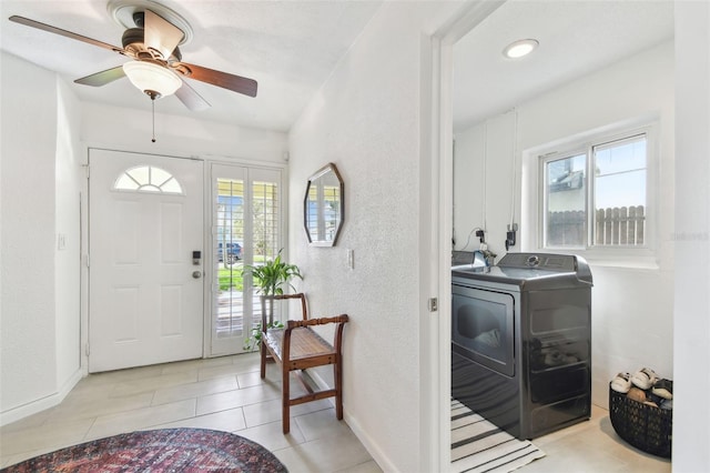 1735 Maryland Ave NE, Saint Petersburg, FL 33703 - entrance foyer featuring plenty of natural light, a textured wall, a ceiling fan, baseboards, and light tile patterned flooring