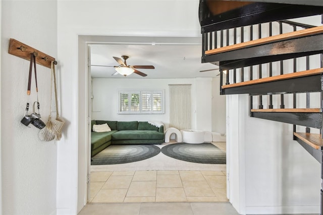 1735 Maryland Ave NE, Saint Petersburg, FL 33703 - stairway featuring ceiling fan and tile patterned flooring