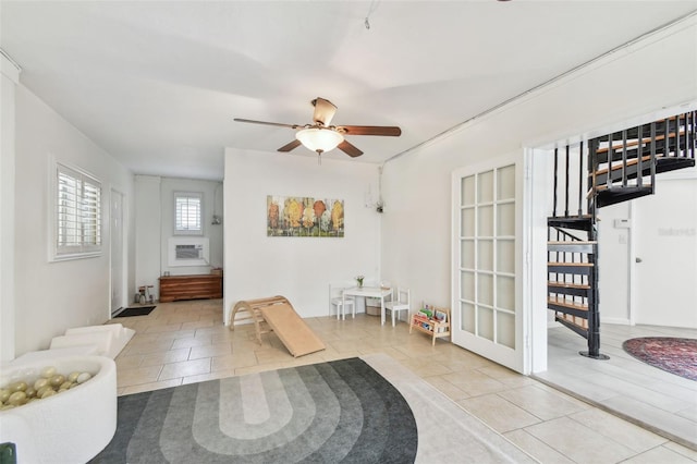 1735 Maryland Ave NE, Saint Petersburg, FL 33703 - entryway with tile patterned floors, stairs, ceiling fan, and cooling unit