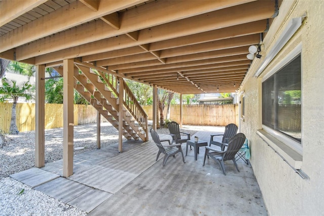 1735 Maryland Ave NE, Saint Petersburg, FL 33703 - view of patio / terrace featuring a fenced backyard and stairs