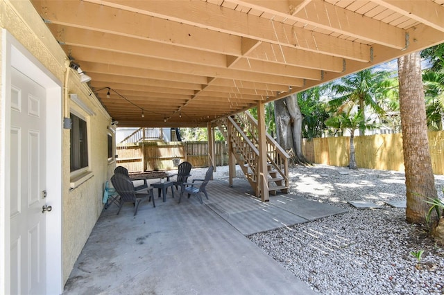 1735 Maryland Ave NE, Saint Petersburg, FL 33703 - view of patio / terrace featuring fence and stairs