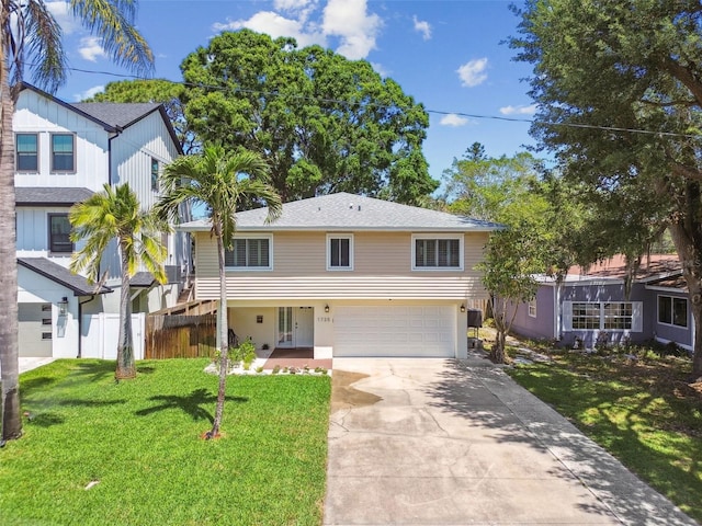 1735 Maryland Ave NE, Saint Petersburg, FL 33703 - view of front of property with an attached garage, driveway, and french doors
