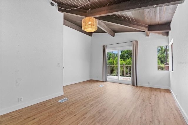 empty room featuring baseboards, vaulted ceiling with beams, wood finished floors, visible vents, and wood ceiling