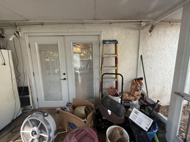 entrance to property featuring stucco siding