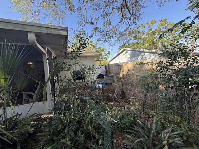 view of side of home with fence
