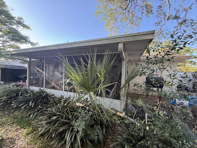exterior space featuring a sunroom