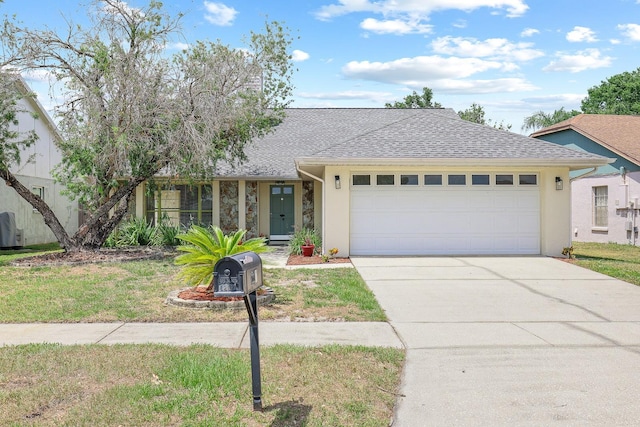 1227 Tuxford Dr, Brandon, FL 33511 - ranch-style home with roof with shingles, an attached garage, concrete driveway, and stucco siding