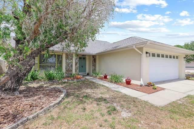 1227 Tuxford Dr, Brandon, FL 33511 - ranch-style home featuring an attached garage, driveway, a shingled roof, and stucco siding