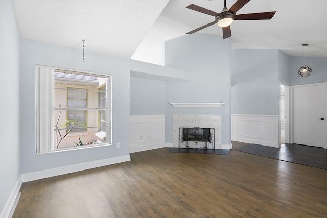 1227 Tuxford Dr, Brandon, FL 33511 - unfurnished living room with a ceiling fan, wainscoting, and wood finished floors