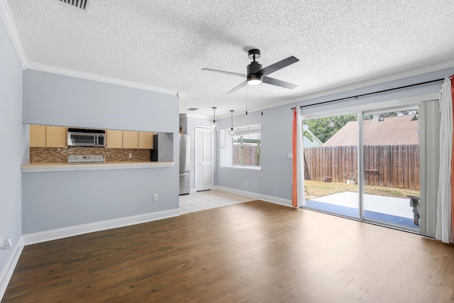 1227 Tuxford Dr, Brandon, FL 33511 - unfurnished living room with a ceiling fan, a textured ceiling, baseboards, ornamental molding, and light wood-style flooring