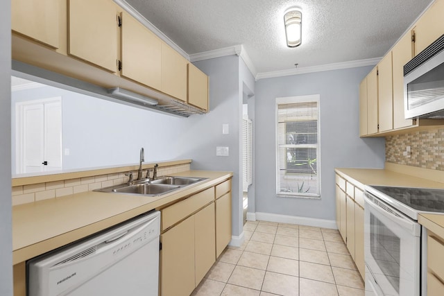 1227 Tuxford Dr, Brandon, FL 33511 - kitchen with white appliances, light countertops, a sink, and tasteful backsplash