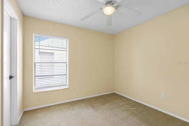 1227 Tuxford Dr, Brandon, FL 33511 - spare room with light colored carpet, a ceiling fan, baseboards, and a textured ceiling