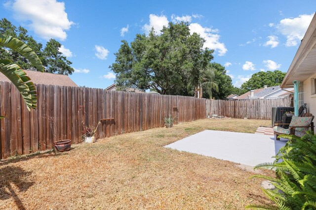 1227 Tuxford Dr, Brandon, FL 33511 - view of yard with a patio, cooling unit, and a fenced backyard