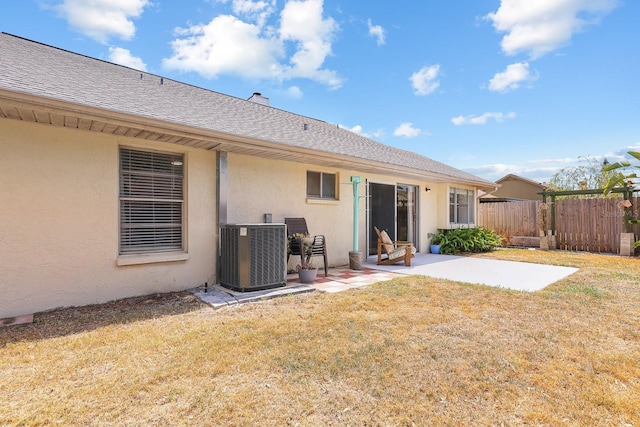 1227 Tuxford Dr, Brandon, FL 33511 - rear view of property with a patio, central AC unit, fence, and stucco siding