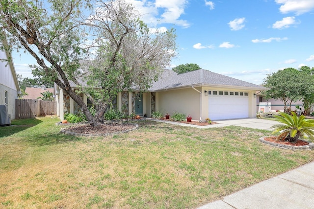 1227 Tuxford Dr, Brandon, FL 33511 - ranch-style home featuring a garage, a front lawn, fence, stucco siding, and concrete driveway