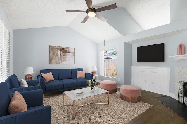 1227 Tuxford Dr, Brandon, FL 33511 - living area featuring wood finished floors, a ceiling fan, lofted ceiling, and a fireplace