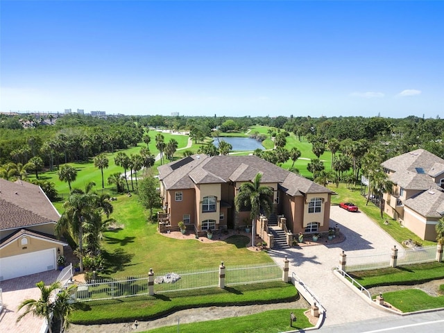 bird's eye view with view of golf course and a water view