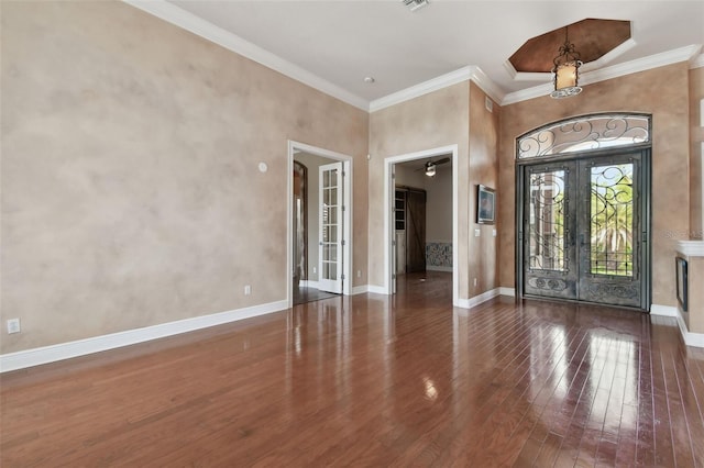 foyer entrance with french doors, visible vents, crown molding, baseboards, and wood-type flooring