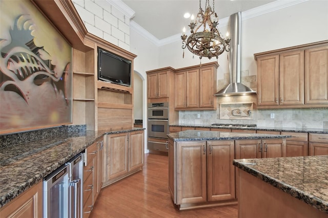kitchen featuring open shelves, beverage cooler, a chandelier, stainless steel appliances, and a warming drawer