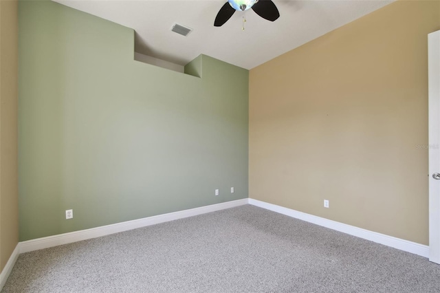 empty room featuring baseboards, carpet, a ceiling fan, and visible vents