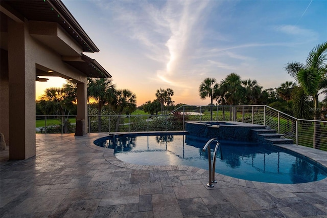 view of swimming pool featuring a patio area and a pool with connected hot tub