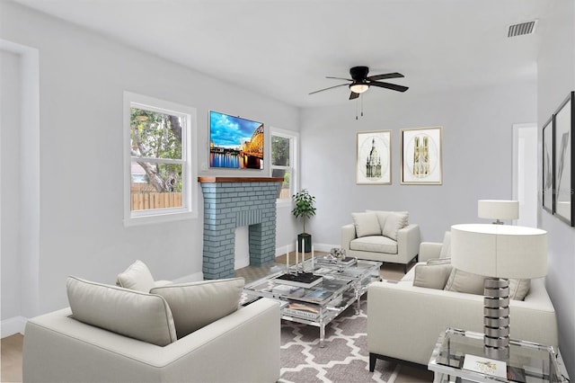 1045 22nd Ave N, Saint Petersburg, FL 33704 - living room with a wealth of natural light, a ceiling fan, a brick fireplace, and visible vents