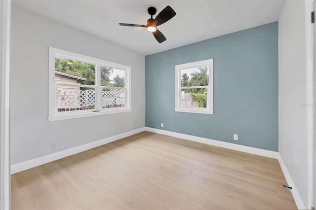 1045 22nd Ave N, Saint Petersburg, FL 33704 - spare room featuring baseboards, a ceiling fan, and light wood-style flooring