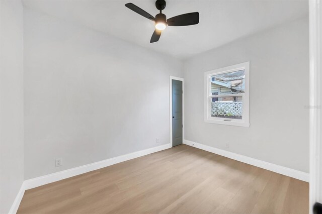 1045 22nd Ave N, Saint Petersburg, FL 33704 - empty room with a ceiling fan, baseboards, and wood finished floors