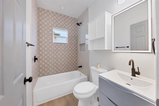 1045 22nd Ave N, Saint Petersburg, FL 33704 - full bathroom featuring vanity, toilet, wood finished floors, and tub / shower combination