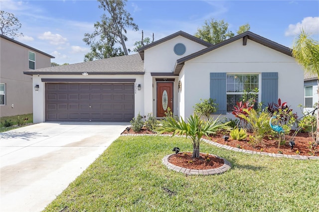 single story home featuring a garage, stucco siding, a front yard, and concrete driveway