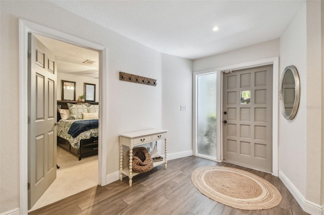 13749 80th Ave, Seminole, FL 33776 - entrance foyer featuring baseboards and wood finished floors
