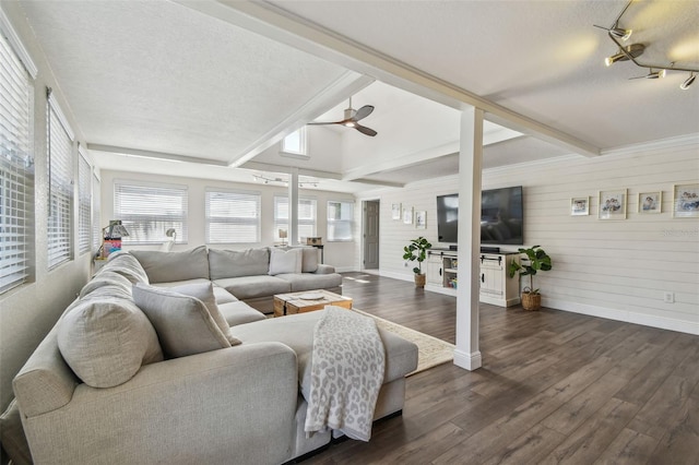 13749 80th Ave, Seminole, FL 33776 - living room with ceiling fan, a textured ceiling, beam ceiling, baseboards, and dark wood-style floors